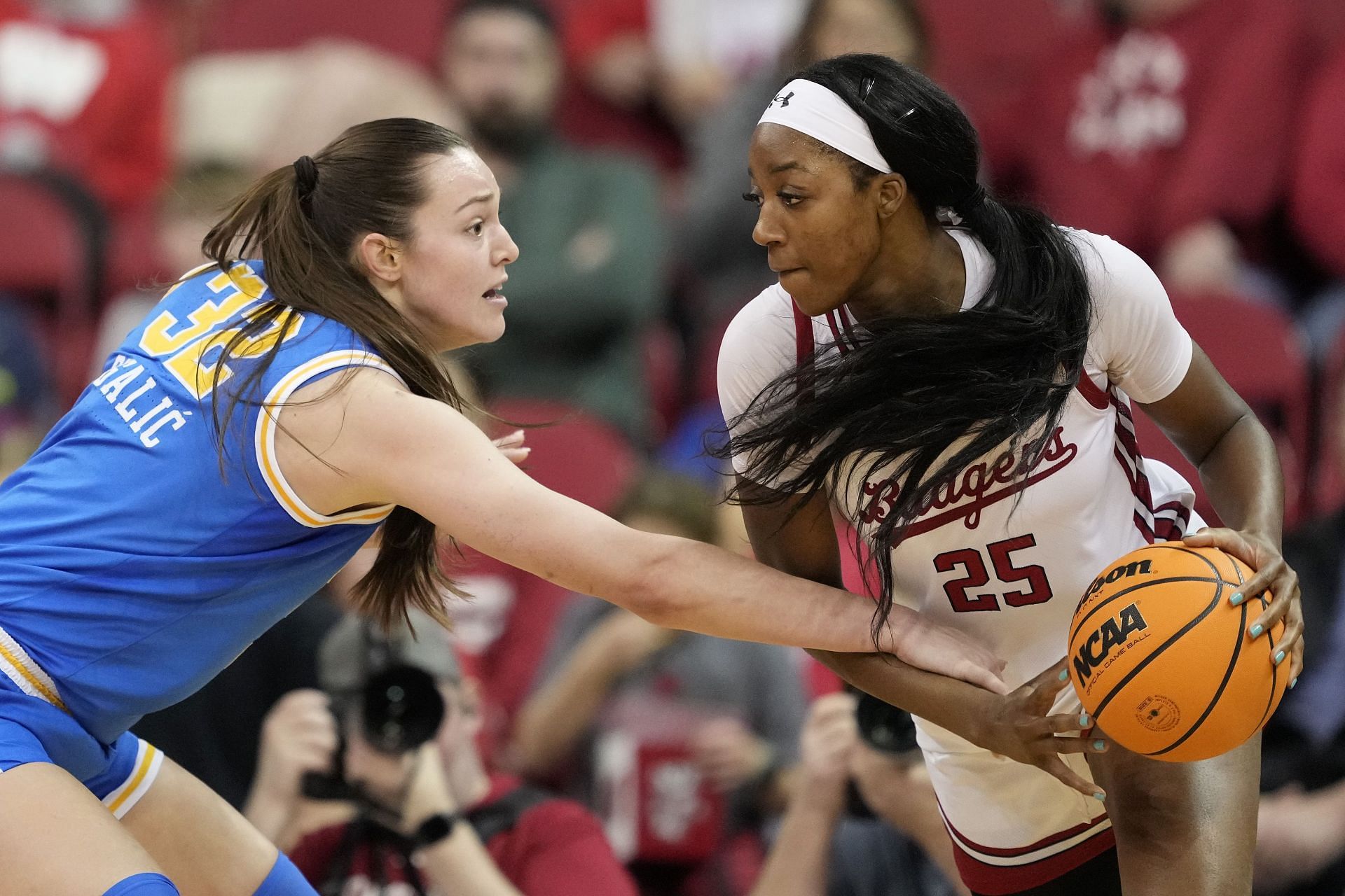 Angela Dugalic (#32) of the UCLA Bruins defends Serah Williams #25 of the Wisconsin Badgers during the third quarter at Kohl Center on February 26, 2025, in Madison, Wisconsin. Photo: Getty